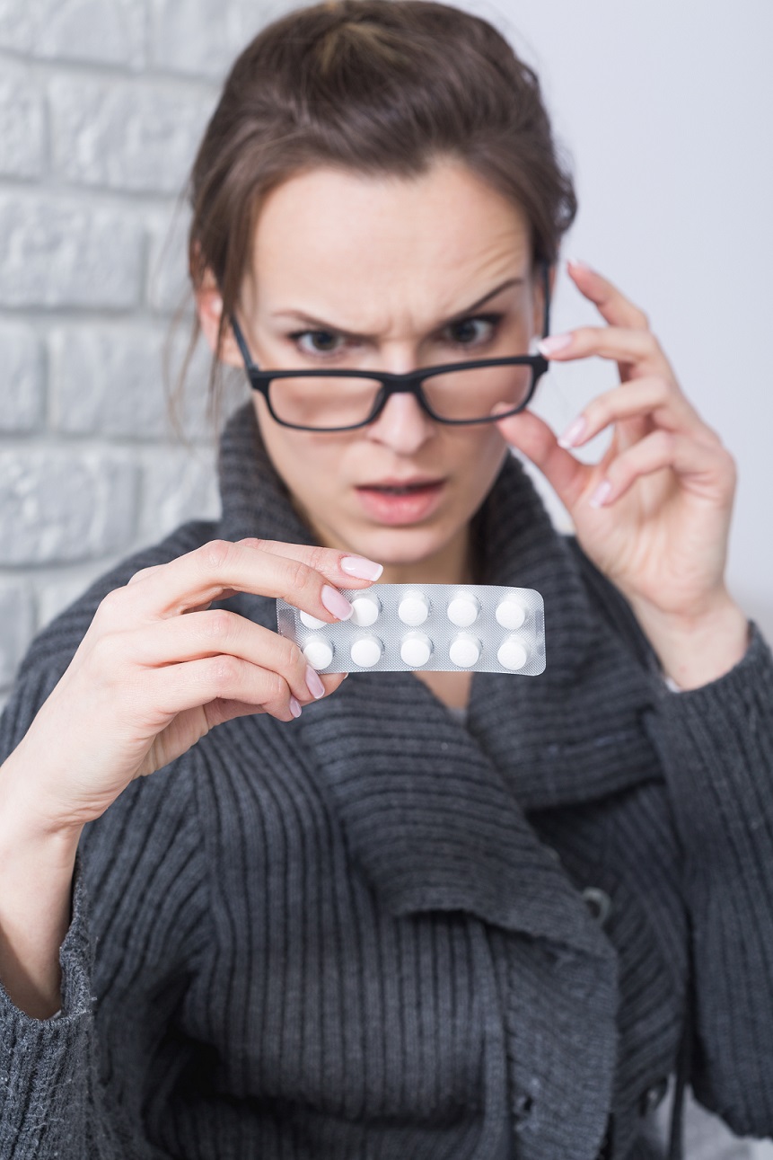 woman reading drug side effects
