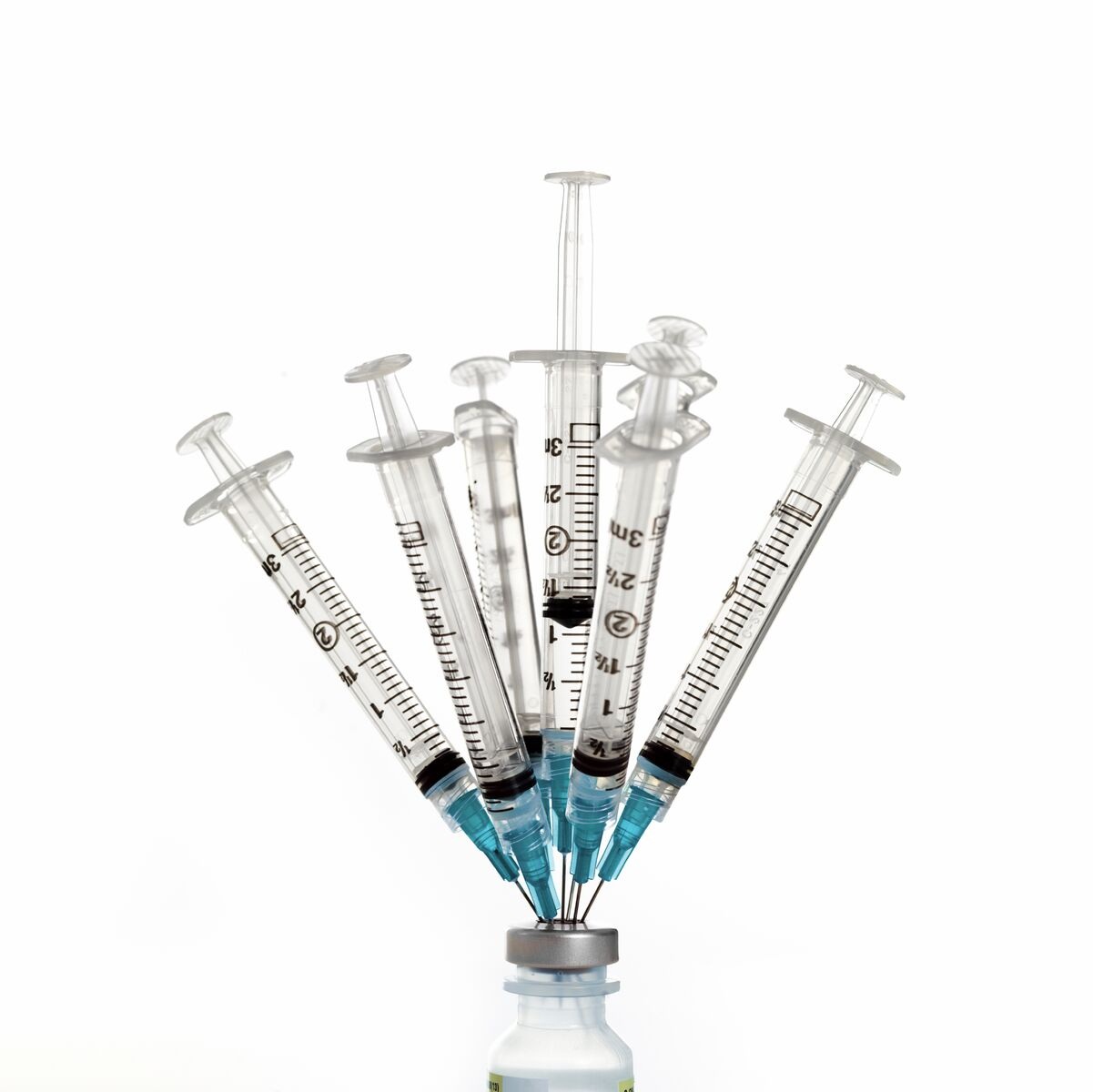 six syringes in vaccine bottle